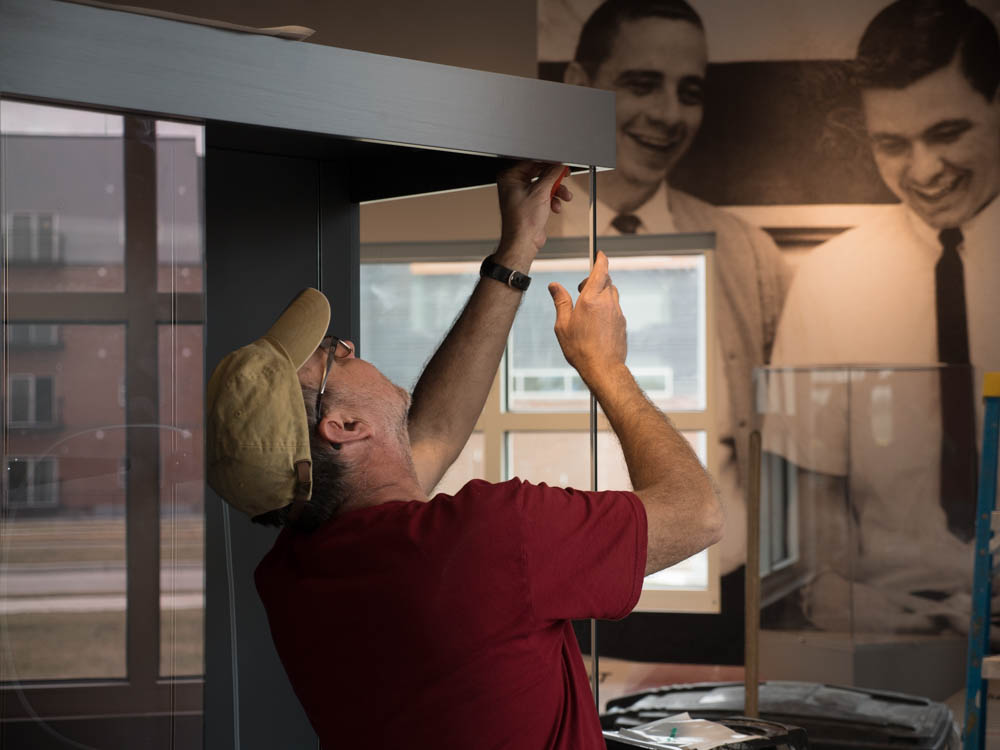 Mark Andres assembling a Cuesta Case in the Pizza Hut Museum in Wichita, Kansas.