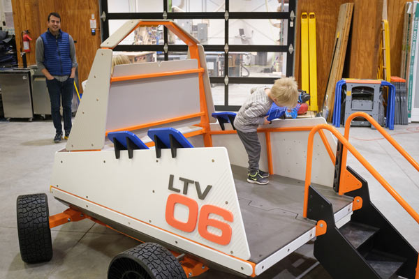 Preschool child playing on the Lunar Rover