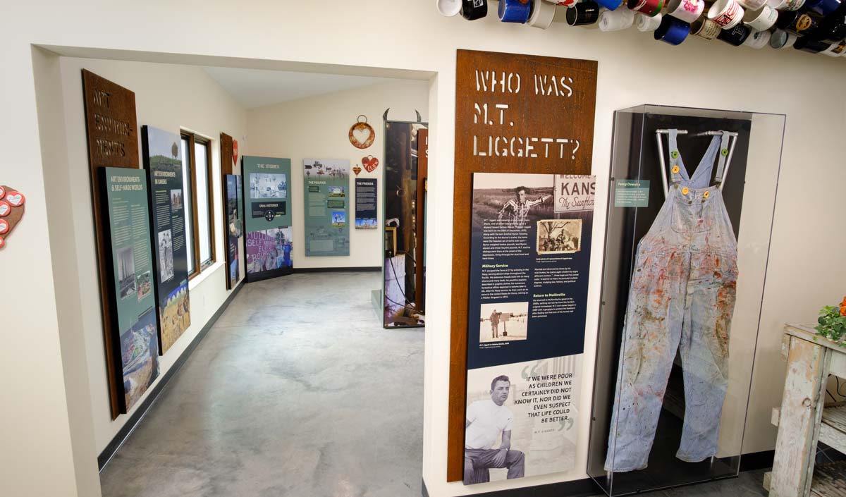 Entrance to the exhibit with overalls display to the right