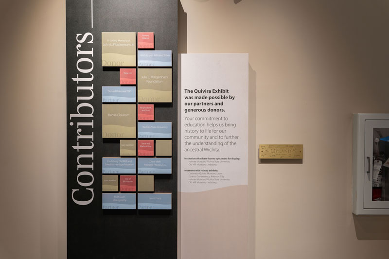 Contributions and support for the exhibit are featured on a modular display with size and color-coded blocks.
