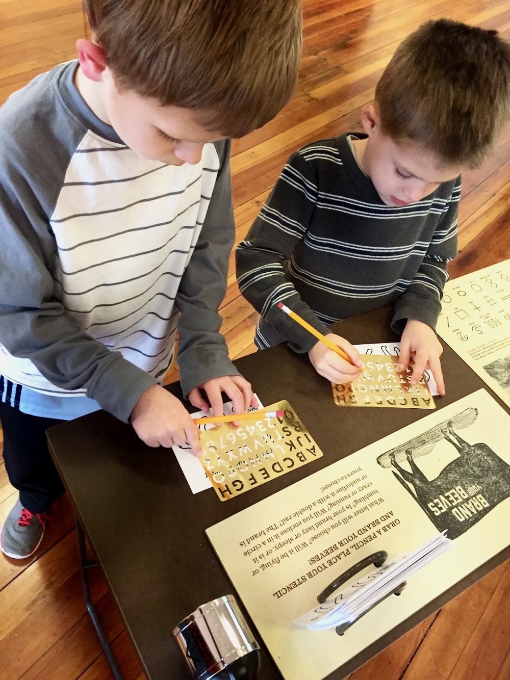 Brand Your Beeves stencil interactive at Chisholm Trail exhibit