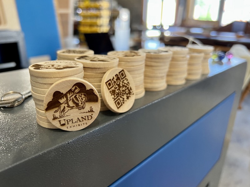 Upland coins on laser cutter