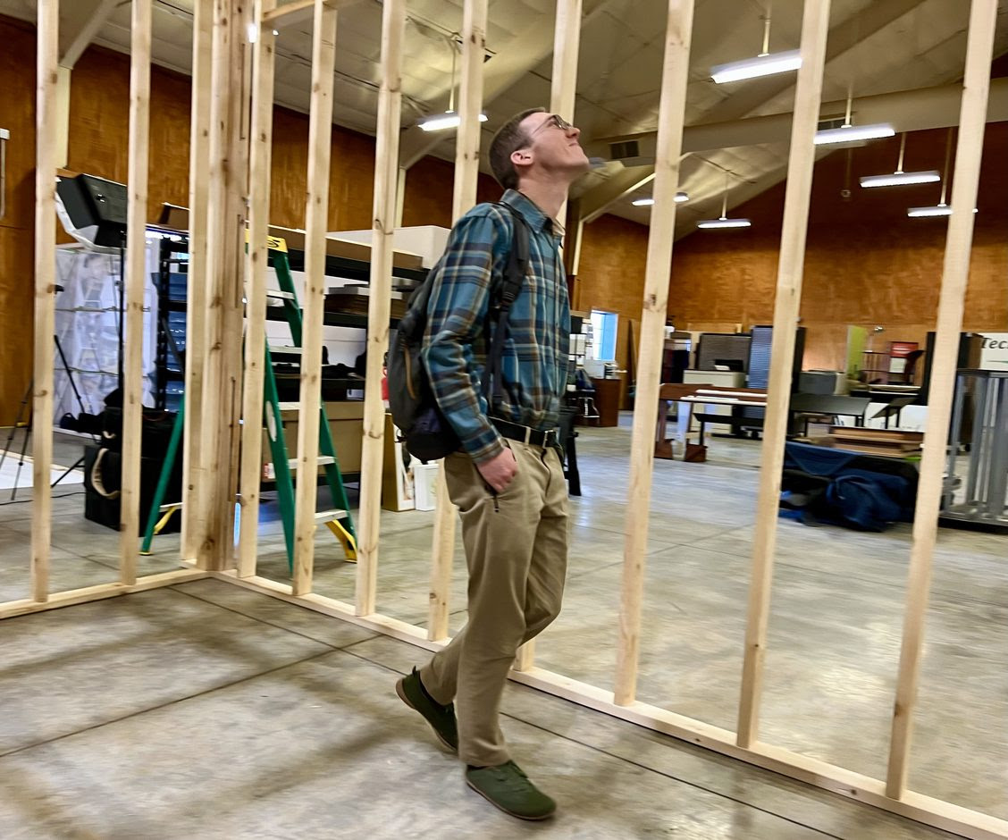 Anthony inspecting office framing